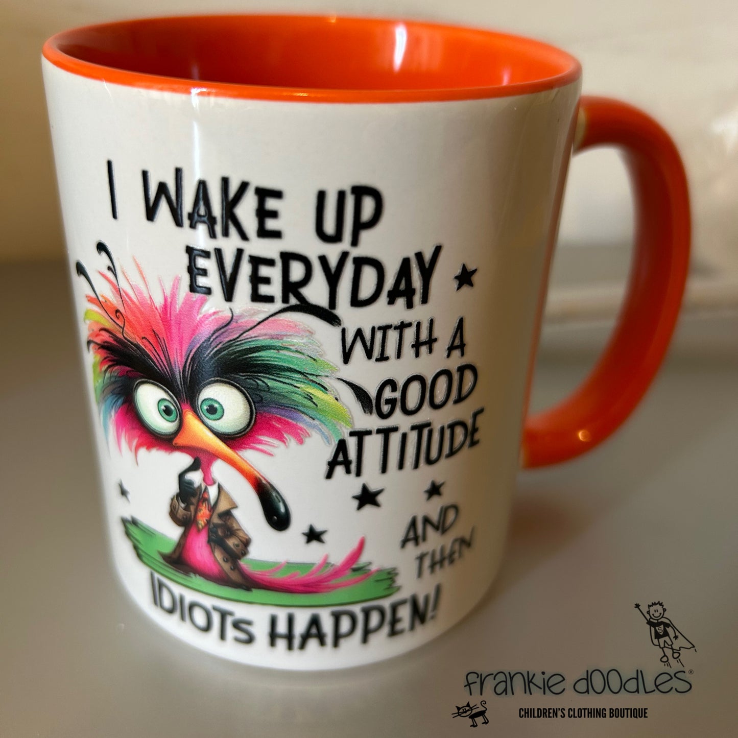 “I Wake Up with a Positive Attitude… But Idiots Happen” Mug